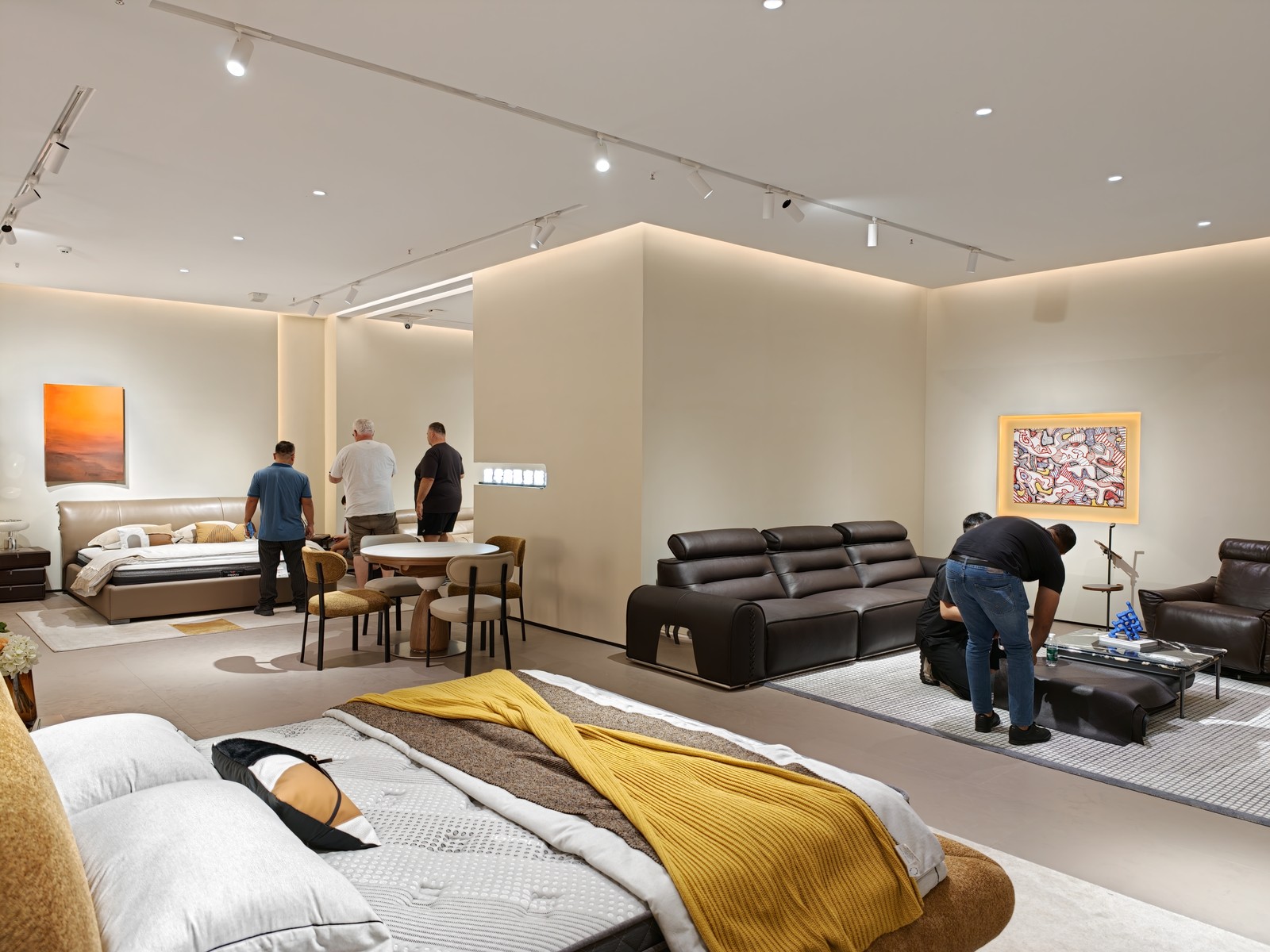 International wholesale buyers from Australia inspecting a new sofa model in ATTICO CASA Foshan showroom